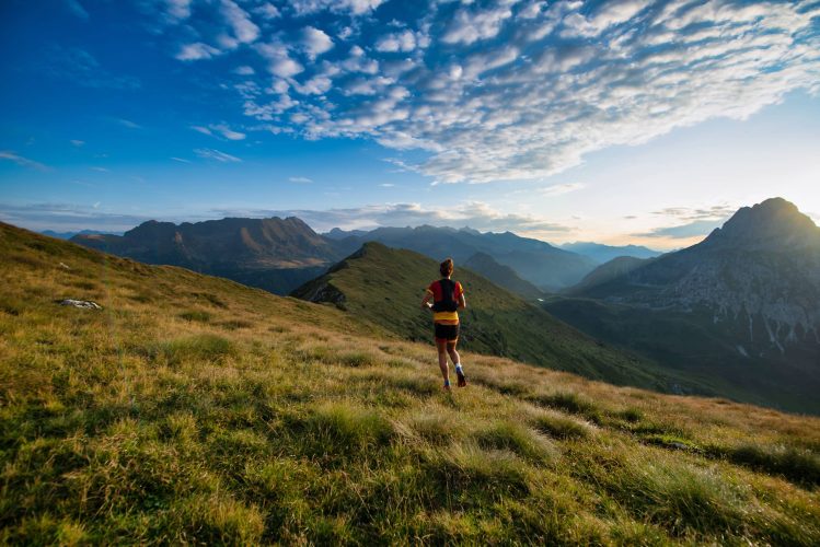 Sports in nature run during the sunrise in the mountains